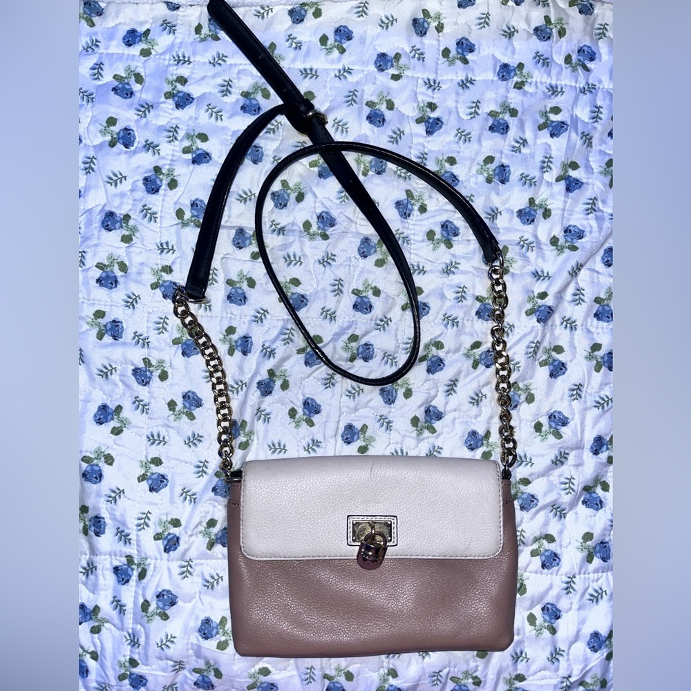 Tan Calvin Klein shoulder bag with a magnetic clip.